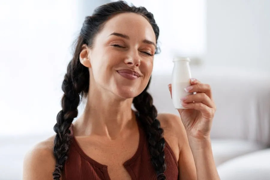 Woman drinking probiotic